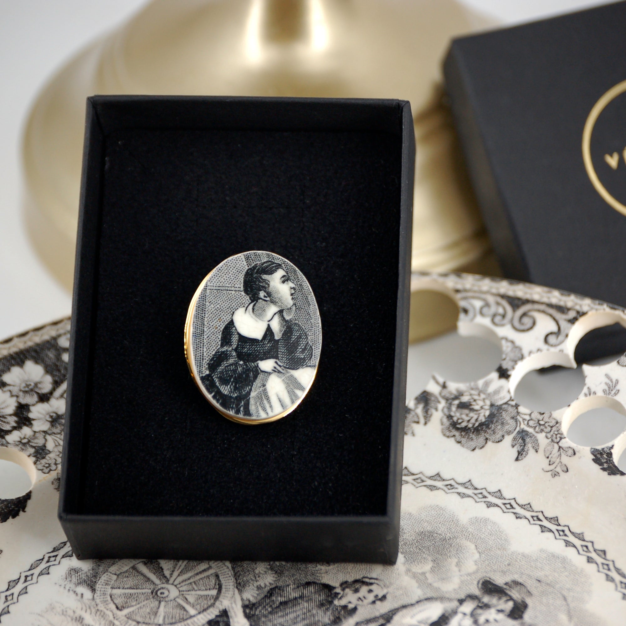 "Portrait of a Young Boy" brooch, gold finish
