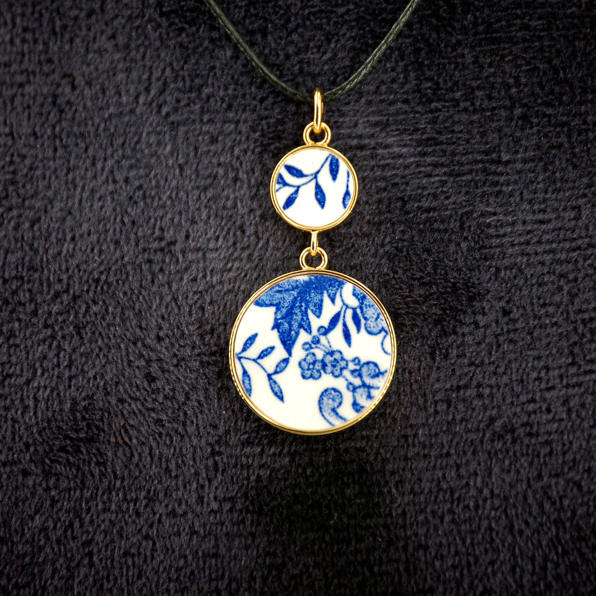 Pendant "Composition of flowers and blue leaves", gold finish