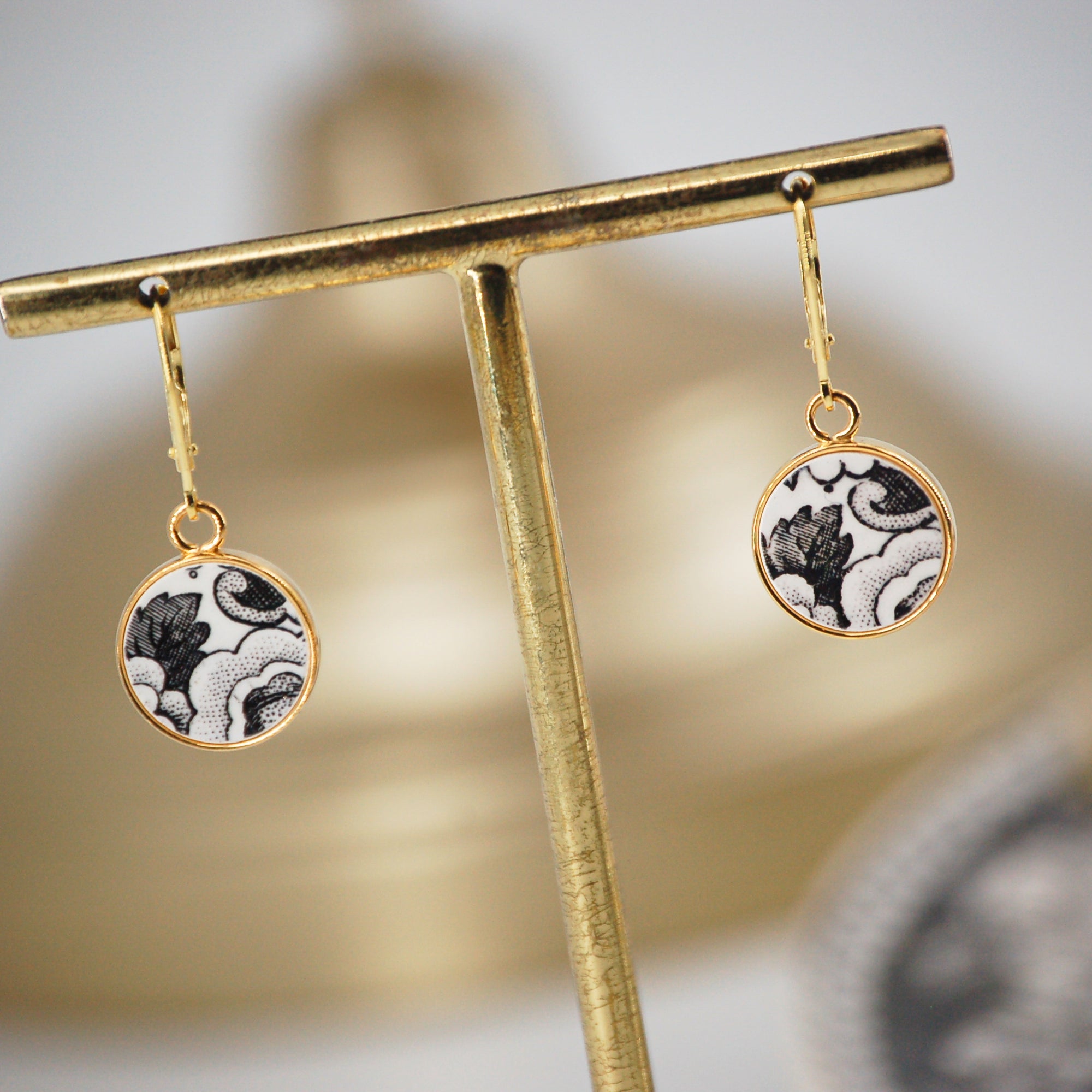 "19th Century Composition" earrings, gold finish